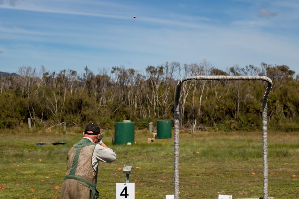 A group at an outdoor range lining up a shot